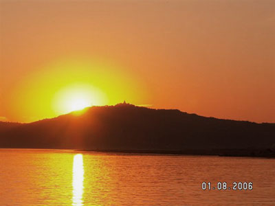 Sun setting over Tent Kyi hill across Ayeyarwaddy river - Bagan