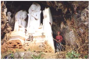 A cave with Buddha images