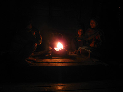 Around the wood fire in the kitchen in a Chin village