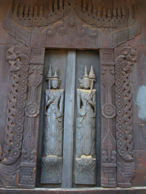 A curved wood door in the monastery